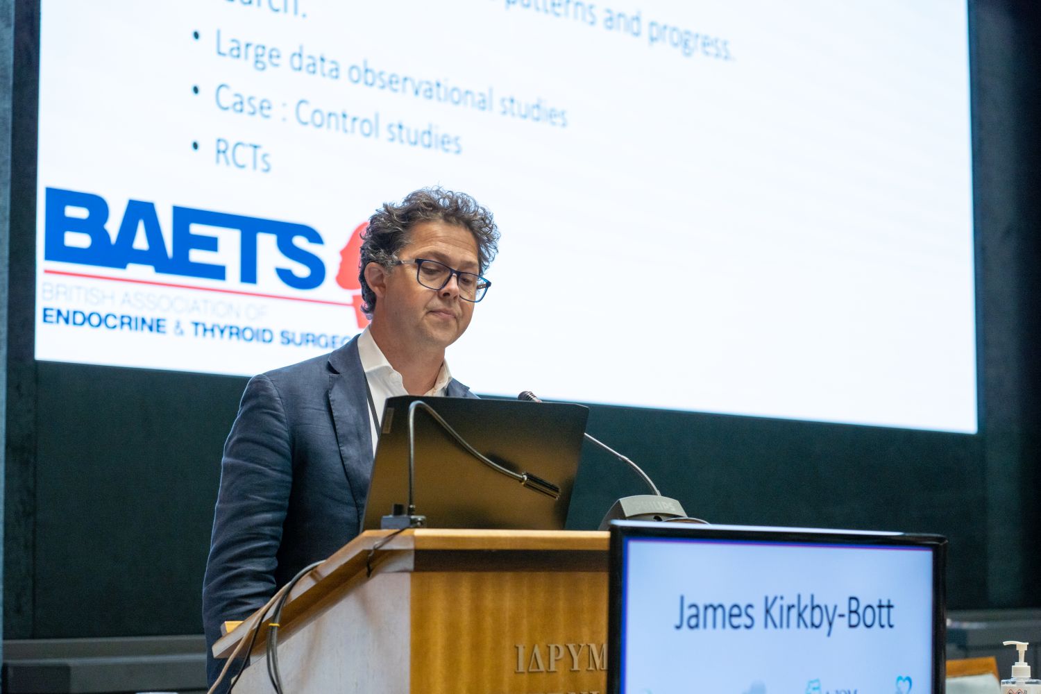 Photo of Consultant Endocrine Surgeon Mr James Kirkby-Bott presenting to the BAETS congress in Athens about the database of surgery outcomes for endocrine surgeons across the UK that he is responsible for.